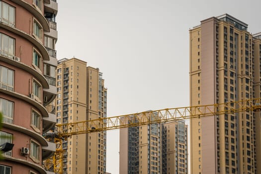 Chengdu, China -  July 2019 : Cranes on the building site of brand new high rise living apartments in the centre of Chengdu, Sichuan Province