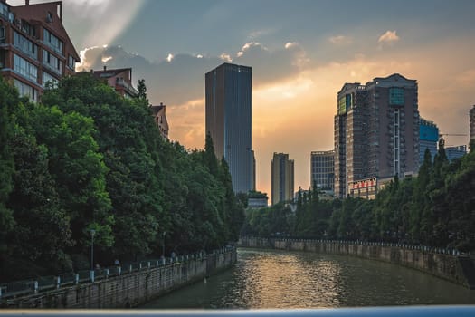 Chengdu, China -  July 2019 : Jin River flowing through Chengdu city at dusk, Sichuan Province