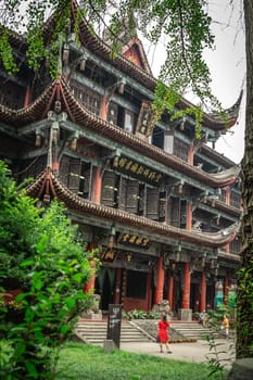 Chengdu, China -  July 2019 : Courtyard and walking path in front of an impressive temple in Wenshu Monastery
