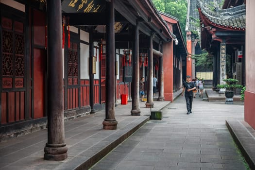 Chengdu, China -  July 2019 :  Tourists walking in a courtyard and walking path in Wenshu Monastery