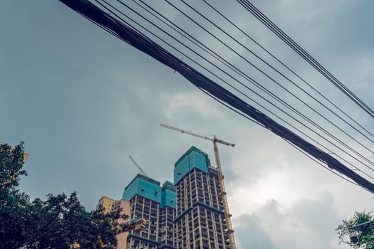 Chengdu, China -  July 2019 : Cranes on the building site of brand new high rise living apartments in the centre of town, Sichuan Province
