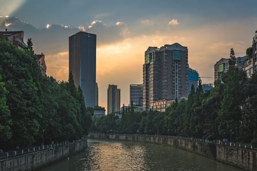 Chengdu, China -  July 2019 : Jin River flowing through Chengdu city at dusk, Sichuan Province