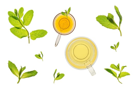 Glass of mint tea with fresh leaves and a bowl of honey. Isolated on a white background, backlit on a light table.. Isolated on a white background, backlit on a light table.