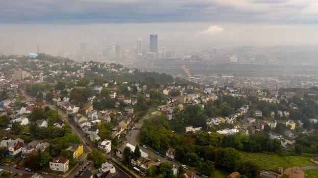 A thick layer of fog still has not burned off over downtown Pittsburgh and suburbs