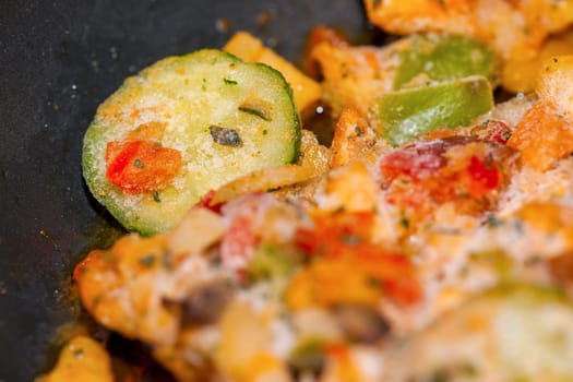 Ratatouille is a French Provencal stewed vegetable dish, originating in Nice. Recipe ingredients include tomato, garlic, onion, zucchini, aubergine (eggplant), bell pepper, and some combination of leafy green herbs common to the region.