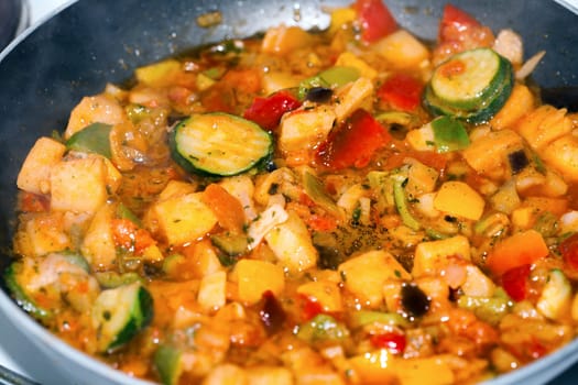 Ratatouille is a French Provencal stewed vegetable dish, originating in Nice. Recipe ingredients include tomato, garlic, onion, zucchini, aubergine (eggplant), bell pepper, and some combination of leafy green herbs common to the region.