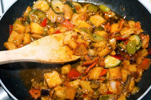 Ratatouille is a French Provencal stewed vegetable dish, originating in Nice. Recipe ingredients include tomato, garlic, onion, zucchini, aubergine (eggplant), bell pepper, and some combination of leafy green herbs common to the region.