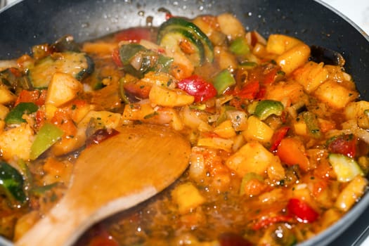 Ratatouille is a French Provencal stewed vegetable dish, originating in Nice. Recipe ingredients include tomato, garlic, onion, zucchini, aubergine (eggplant), bell pepper, and some combination of leafy green herbs common to the region.
