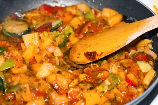 Ratatouille is a French Provencal stewed vegetable dish, originating in Nice. Recipe ingredients include tomato, garlic, onion, zucchini, aubergine (eggplant), bell pepper, and some combination of leafy green herbs common to the region.