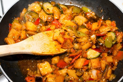 Ratatouille is a French Provencal stewed vegetable dish, originating in Nice. Recipe ingredients include tomato, garlic, onion, zucchini, aubergine (eggplant), bell pepper, and some combination of leafy green herbs common to the region.