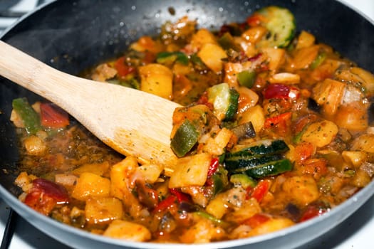 Ratatouille is a French Provencal stewed vegetable dish, originating in Nice. Recipe ingredients include tomato, garlic, onion, zucchini, aubergine (eggplant), bell pepper, and some combination of leafy green herbs common to the region.