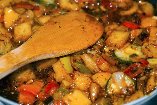 Ratatouille is a French Provencal stewed vegetable dish, originating in Nice. Recipe ingredients include tomato, garlic, onion, zucchini, aubergine (eggplant), bell pepper, and some combination of leafy green herbs common to the region.