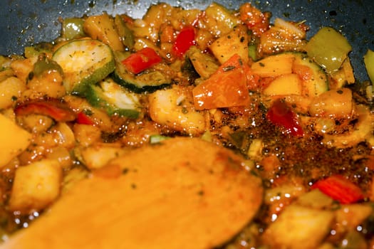 Ratatouille is a French Provencal stewed vegetable dish, originating in Nice. Recipe ingredients include tomato, garlic, onion, zucchini, aubergine (eggplant), bell pepper, and some combination of leafy green herbs common to the region.