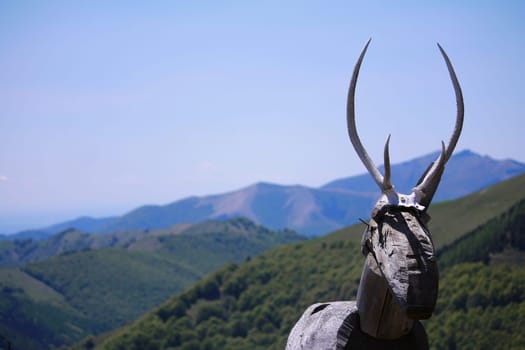 The wooden deer sculpture