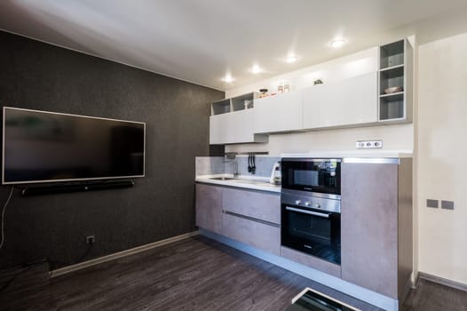 Russia, Moscow- June 11, 2019: interior room apartment. standard repair decoration in hostel. kitchen and dining room