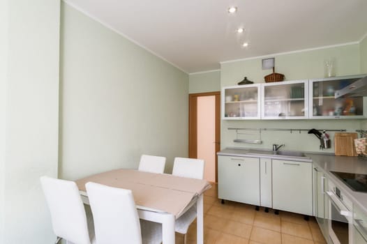 Russia, Moscow- June 11, 2019: interior room apartment. standard repair decoration in hostel. kitchen and dining room