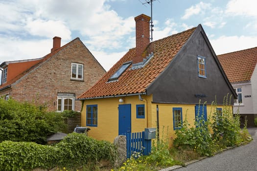 SVANEKE, DENMARK - JULY 4, 2017: Traditional colorful half-timbered houses on Bornholm island in Svaneke Denmark.