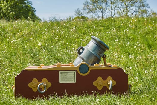 FREDERICIA, DENMARK - MAY 24, 2017: Old bronze cannon on rampart in city Fredericia, Denmark.