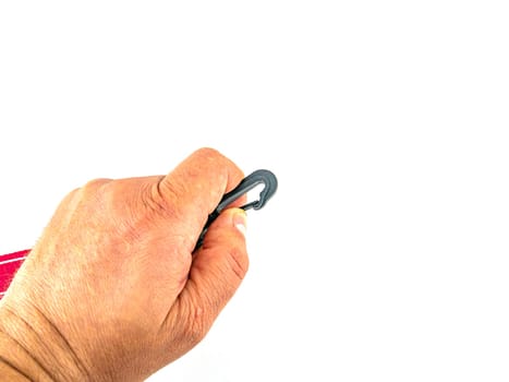 Plastic carabiner in hand on a white background. Place for text.