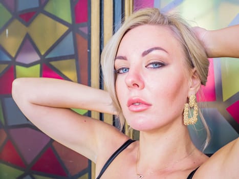 Blonde girl on a colored background. People. Background image.