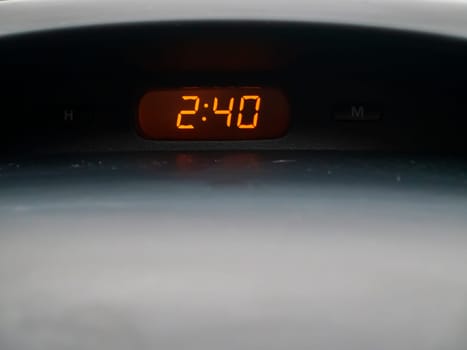 The clock inside the car. Place for text. Transport.