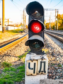 Railway traffic light of red color. Railway. Transport.