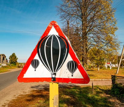 Balloons are flying - warning road sign. Transport.