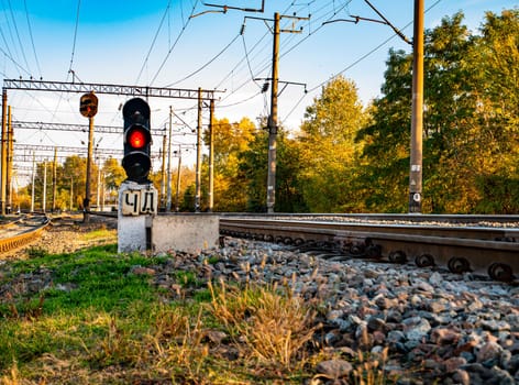 Railway traffic light of red color. Railway. Transport.