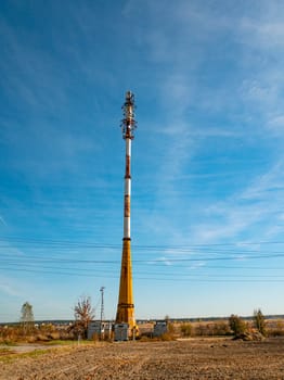 Mobile communications tower on a background of blue sky. Communications. Technologies.