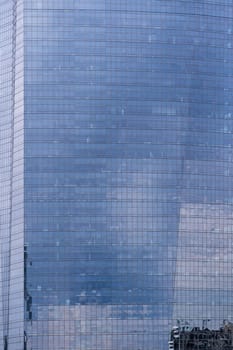 Urban abstract - window facade of business center office building with reflections and colours. Philadelphia PA USA