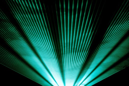Luxury entertainment in nightclub event, festival, concert or New Years Eve. Ray beams are symbol for science and universe research.