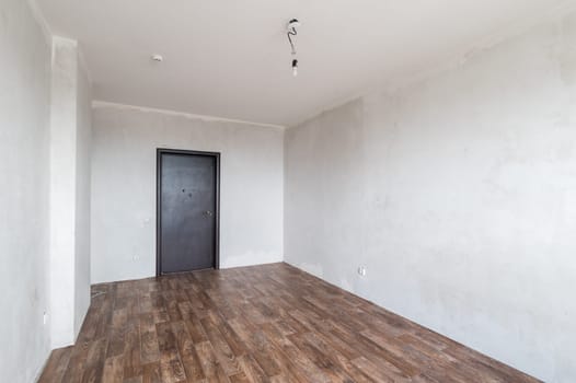 Russia, Moscow- June 11, 2019: interior room apartment. standard repair decoration in hostel. rough repair for self-finishing. finishing stage of construction