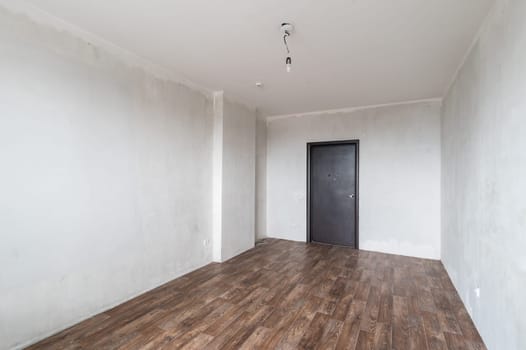 Russia, Moscow- June 11, 2019: interior room apartment. standard repair decoration in hostel. rough repair for self-finishing. finishing stage of construction