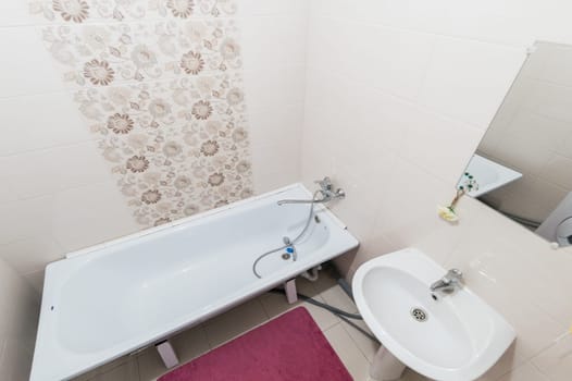 Russia, Moscow- June 11, 2019: interior room apartment. standard repair decoration in hostel. bathroom and toilet