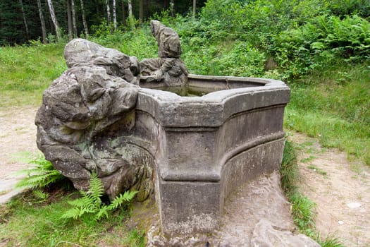 The Bethlehem of Braun or Kusk Forest Sculptures is a complex of Baroque statues and relieves carved by famous sculptor Matthias Bernard Braun directly in sandstone rocks in the forest near complex Kuks Hospital in Northern Bohemia, Czech Republic. Part of the sculptures in the New Forest is ranked the best works of Czech Baroque sculpture. Since 2002, the area is protected as a National Historic Landmark and were listed in the 2000 World Monuments Watch by the World Monuments Fund.