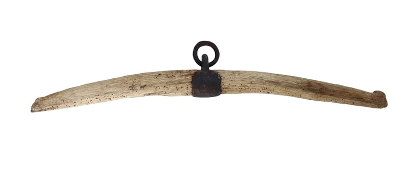 Old worn yoke - part of harnesses for the draft animals on white background