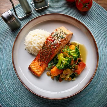The Pave de Saumon features seared salmon with sautéed vegetables and rice drizzled with a tangy creamy sorrel sauce.
