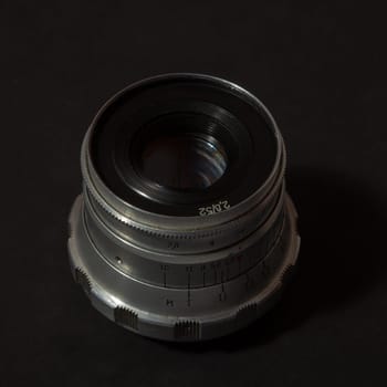 Retro Camera Lens on the black background
