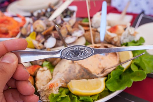 Brown crab fork and portuguese seafood meal or marisqueira as background