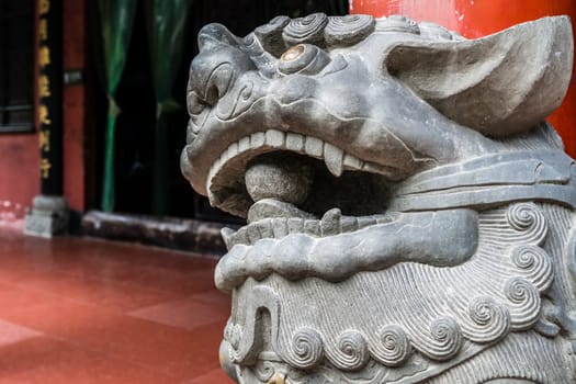 Lion head sculpture figure in the courtyard of the Wenshu Monastery, Chengdu, China