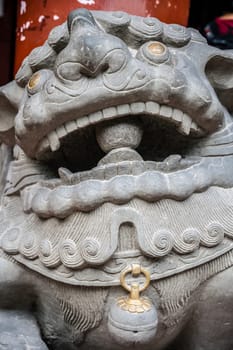 Lion head sculpture figure in the courtyard of the Wenshu Monastery, Chengdu, China
