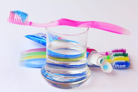 Healthy, well-kept teeth by brushing with toothbrushes and toothpaste