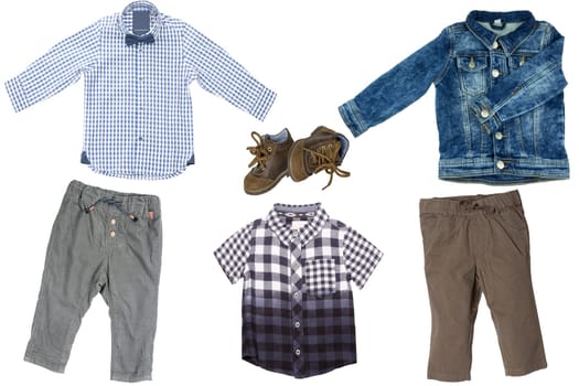 Collage set of children clothes. Two Denim jeans or pants, a pair shoes, a jeans jacket and two blue checkered shirts or t-shirts for child boy isolated on a white background. Concept spring autumn and summer clothes.