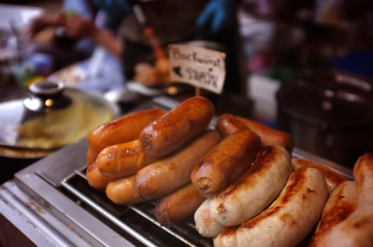 Delicious  Grilled sausages using torch.