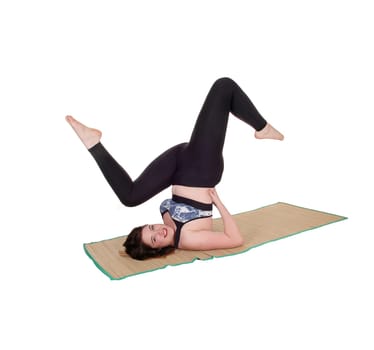 A beautiful young woman exercising on the floor lifting up her body,.in a sports outfit, isolated for white background.