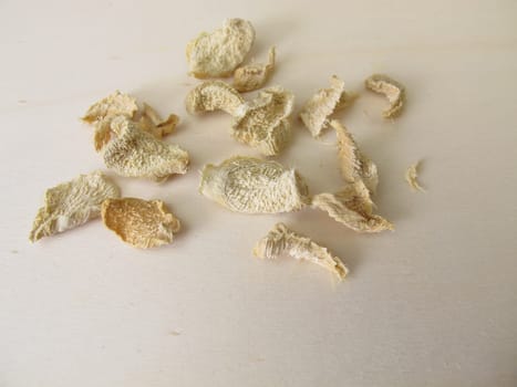 Dried ginger on a wooden board