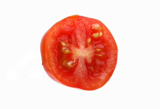 Levitating halves of cherry tomatoes close-up isolated on a white background