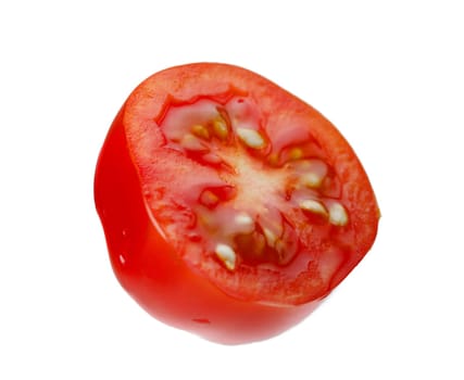Levitating halves of cherry tomatoes close-up isolated on a white background