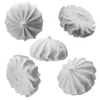Levitating white meringues closeup on a white background, set of 5 pieces