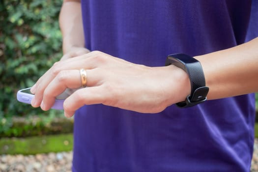 Healthy lifestyle concept female wearing sport tracker wristband arm, stock photo